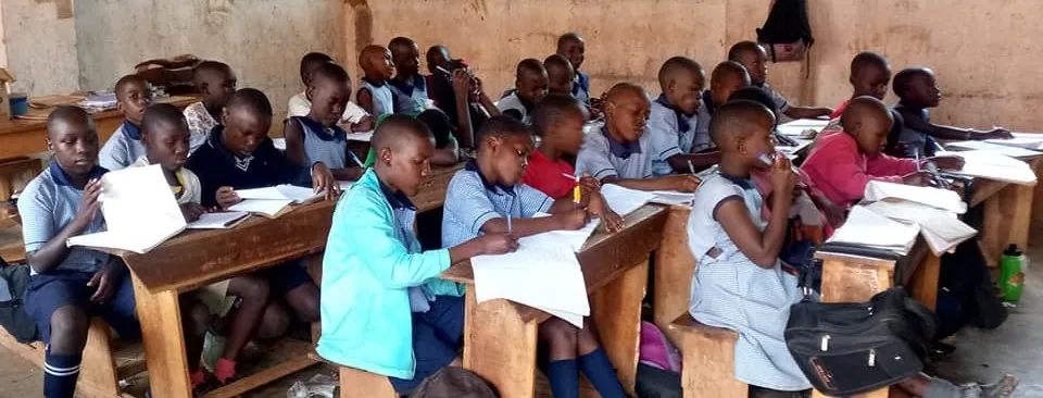 Students working together at desks in a classroom